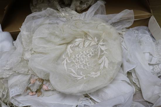 A 1920s lace wedding dress together with a collection of lace and white work and a lace bonnet